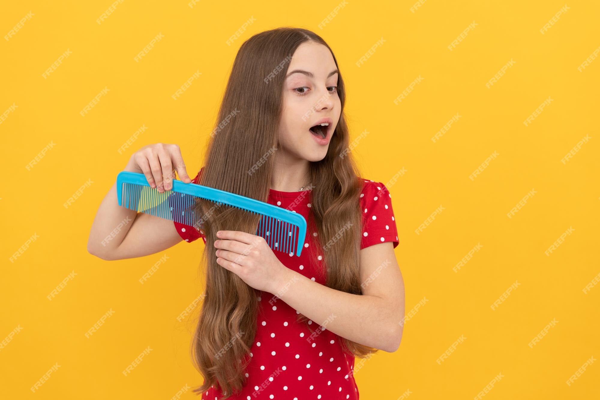 Premium Photo | Haircare and hair loss female fashion model surprised kid  combing long hair hairdresser
