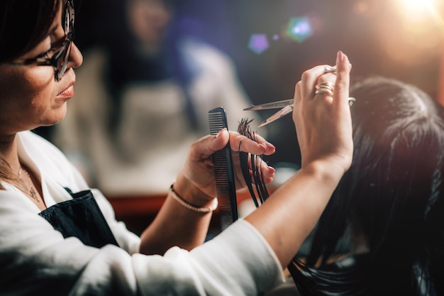 hairdresser cutting womans hair
