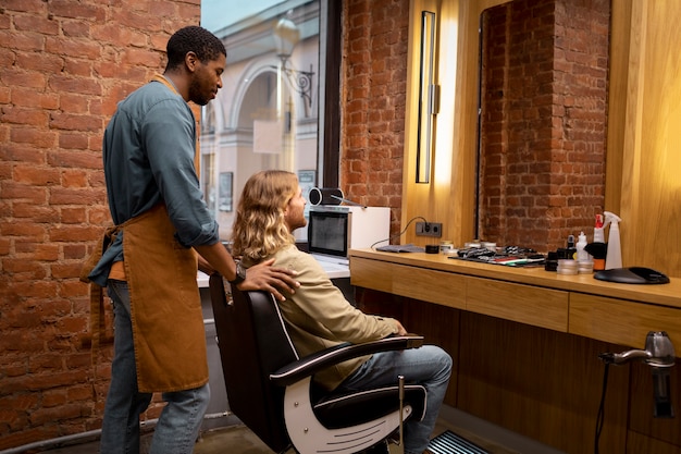 Hairdresser grooming their client