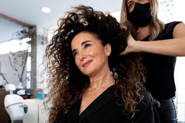 Hairdresser massaging the hair of a client in a salon