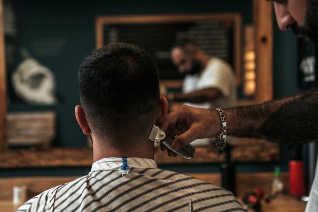 Hairdresser serving a client in a barbershop