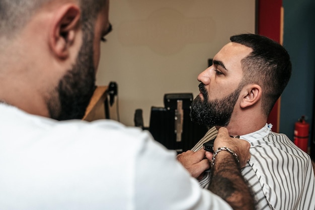 Hairdresser serving a client in a barbershop