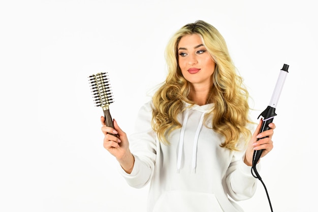 Hairdresser tips Create hairstyle with curling iron Woman with long curly hair use curling iron Girl adorable blonde Buy tools Online shop Useful Curling Iron Tricks Everyone Should Know