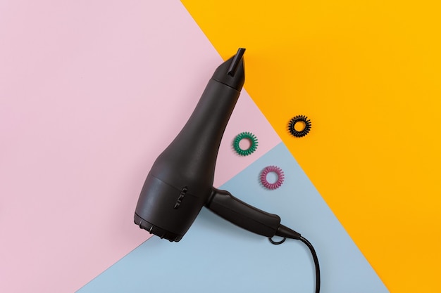 Hairdresser tools on a colored background with copy space. Top view. Still life. Mock-up. Flat lay