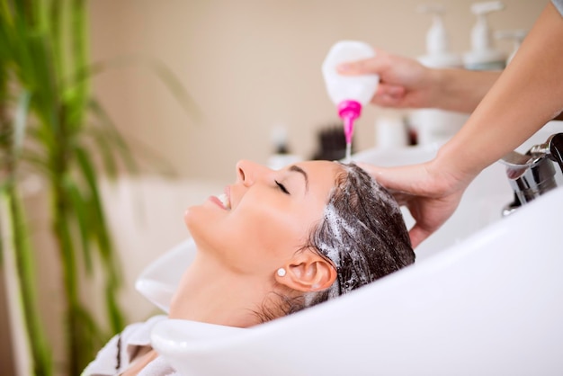 Hairdresser washing hair