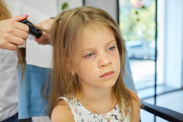 Hairdressing services Reating hairstyle Hair styling process Children hairdressing salon