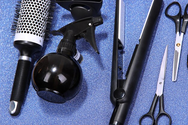 Hairdressing tools on blue background