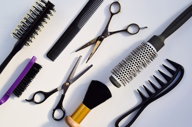 Hairdressing various accessories on a light surface