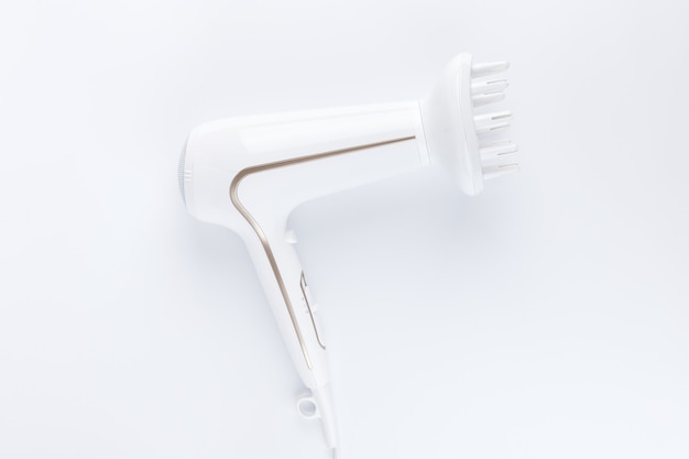 Hairdryer with a diffuse styling attachment on a white background