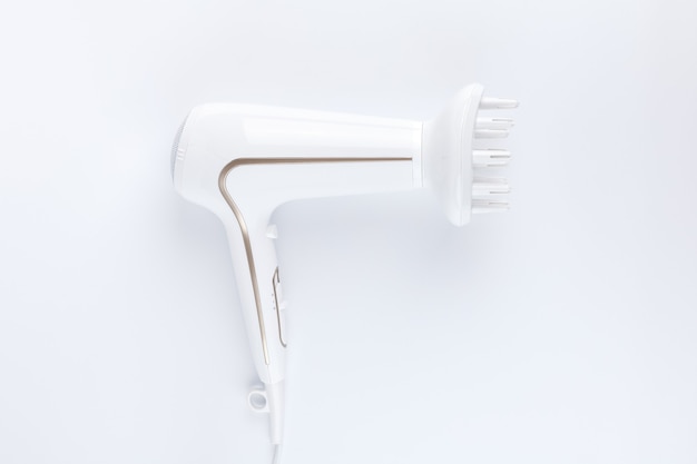 Hairdryer with a diffuse styling attachment on a white background