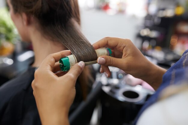 Hairstylist Using Hair Rollers