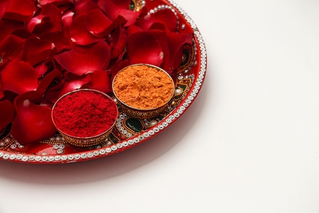 Haldi and kumkum thali with rose petals