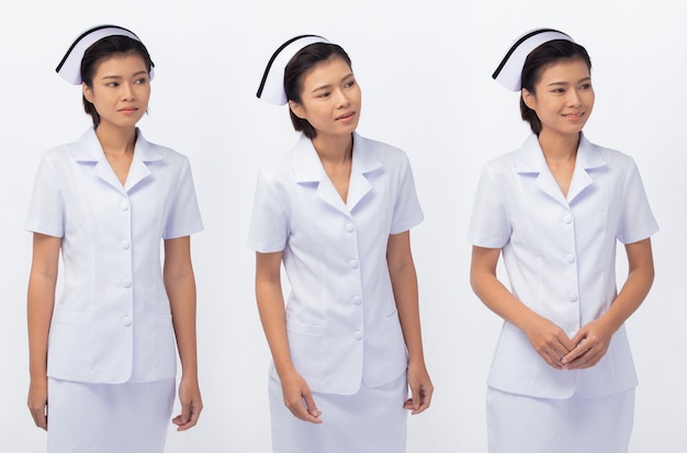 20 대 아시아 여자의 반신 그림 스냅은 간호사 흰색 유니폼 바지 치마와 신발을 착용, 흰색 배경 절연
