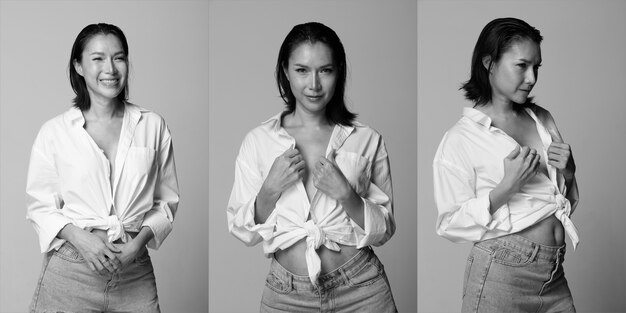 Half Body Portrait of 40s Asian LGBTQIA+ Woman black hair white vast short jean pant. Transgender 30s female express feeling happy smile many poses over white Background isolated