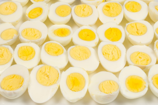 Half boiled eggs background. top view.