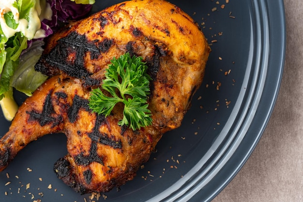 Half chicken baked in a sauce of garlic, soy, ginger, and honey.