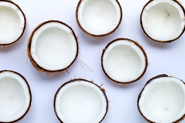 Half coconuts on white background. Copy space