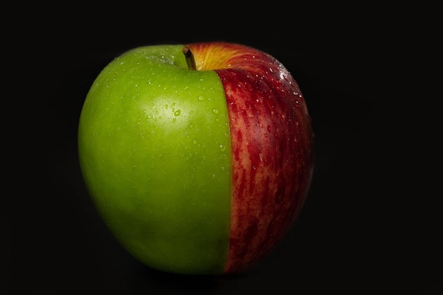 Half green apple and half red apple