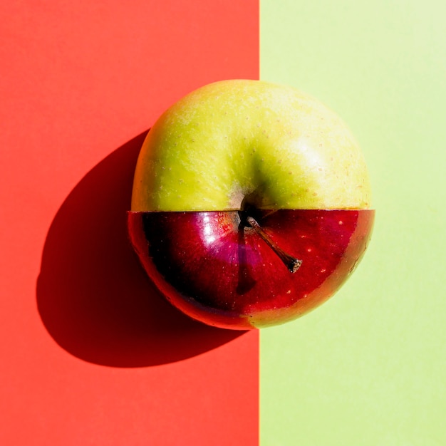 Half green half red apple