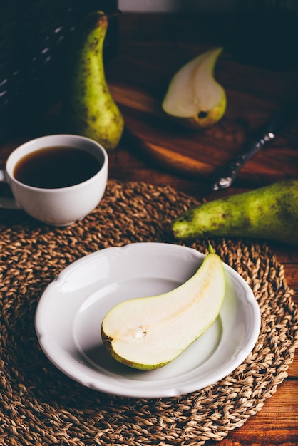 Half of Green Pear on White Plate