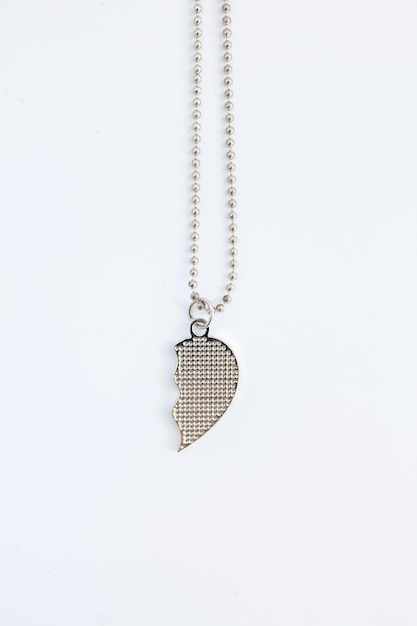 Half heart locket on a white background