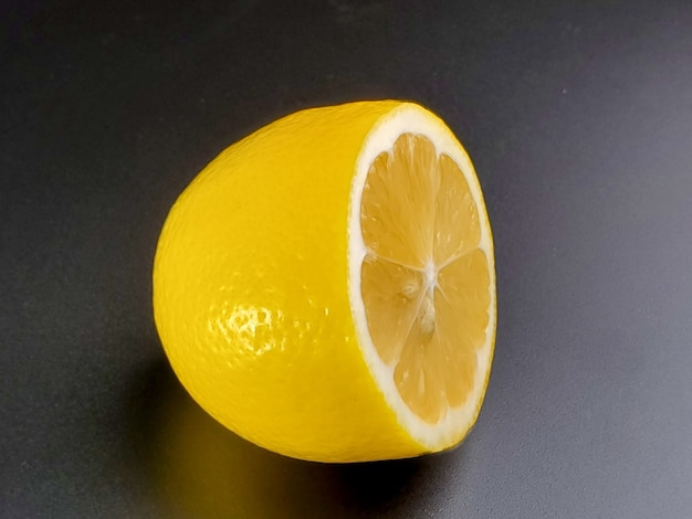 Photo half lemon isolated on black