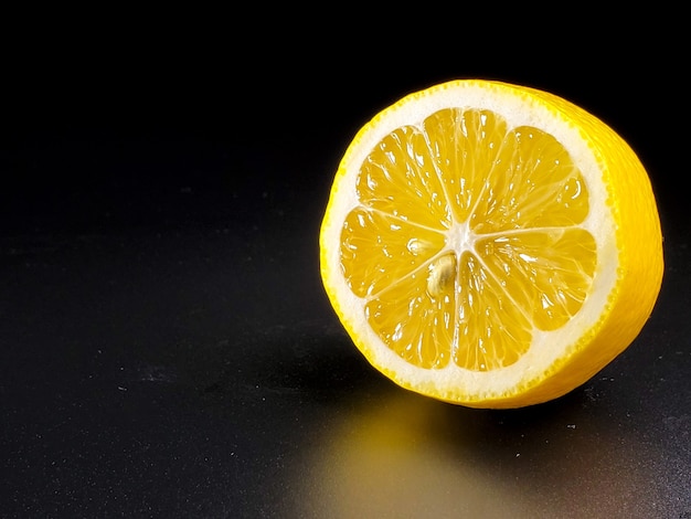 Half lemon isolated on black