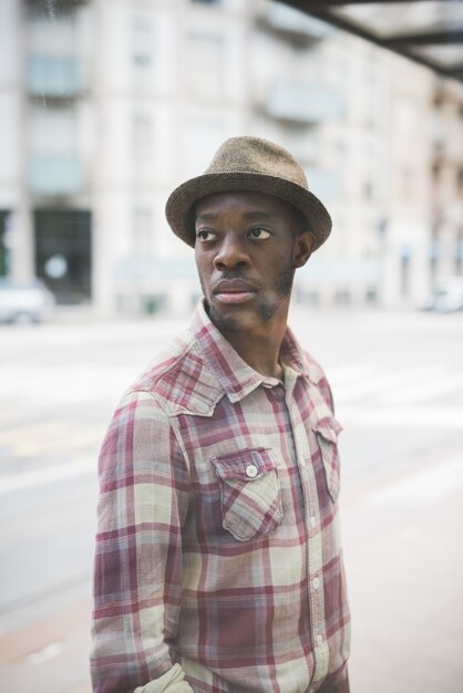 Half length portrait of young handsome afro black man overlooking left