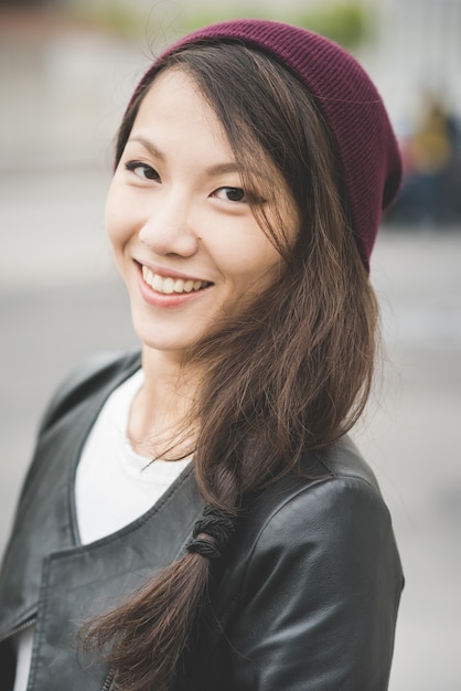 half length of young handsome asiatic chinese woman looking in camera