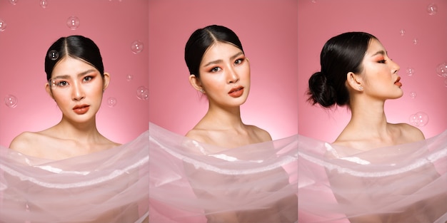 Half lichaam portret van 20s Aziatische mooie vrouw zwart haar high fashion make-up. Cute Girl glimlach roze pastel zeepbel zeep vliegen over vele poses over achtergrond.