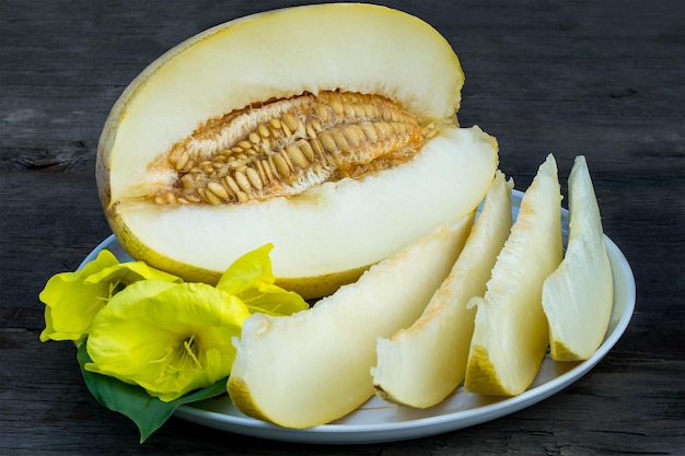 Half of melon and slices on a plate