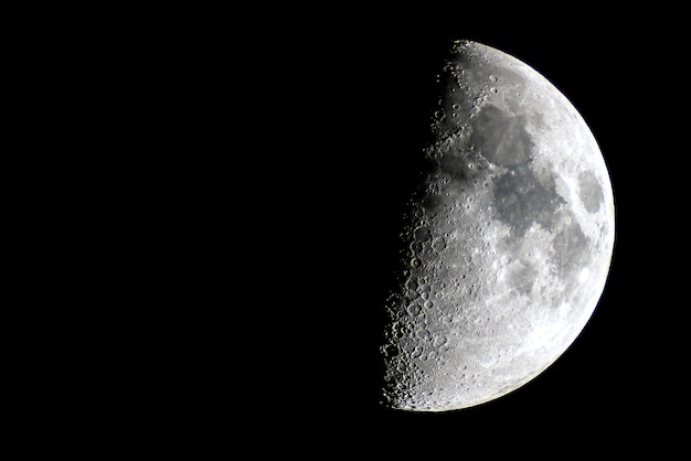 Half moon over a night sky