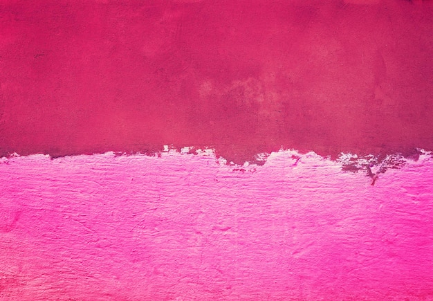 Half painted concrete wall Abstract grunge background Pink magenta gradient color