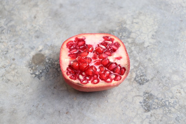 Half pomegranate on the floor