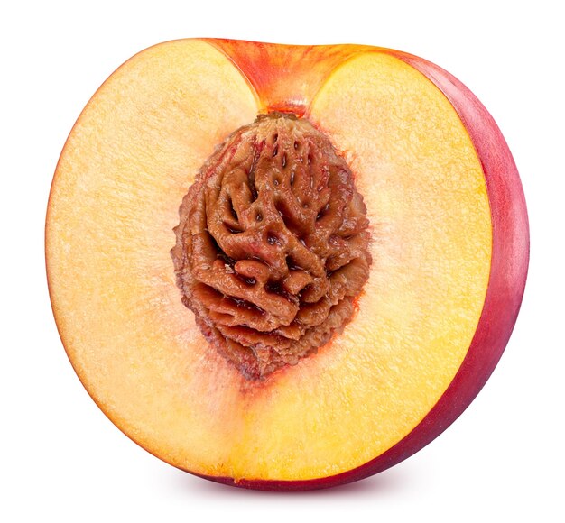 Half ripe juicy peach isolated on white background