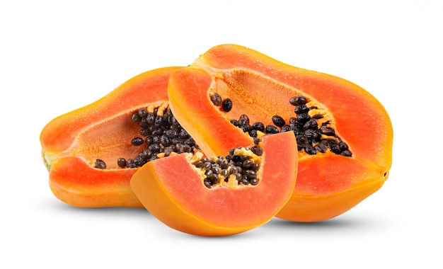 Half of ripe papaya fruit with seeds isolated on white