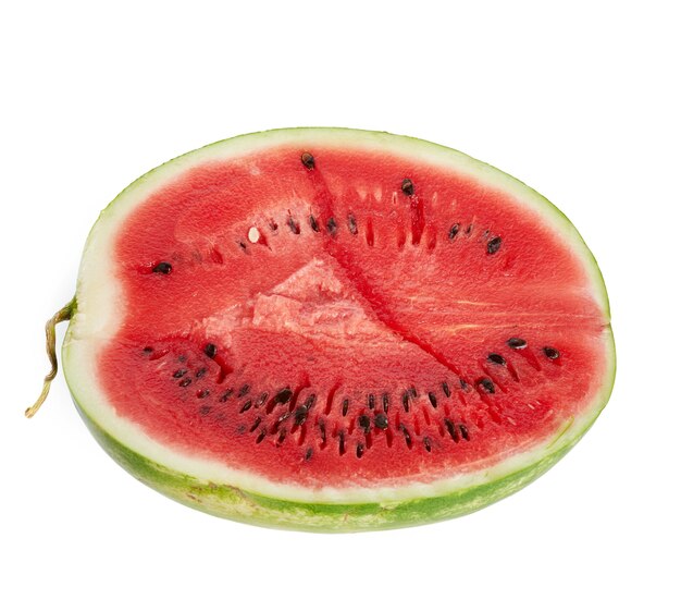 Half ripe red watermelon with seeds isolated on white