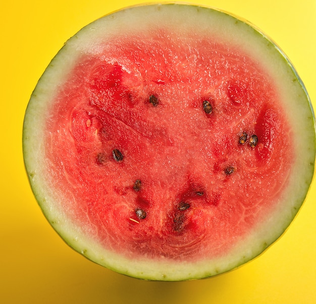 Half round ripe red watermelon with brown seeds 