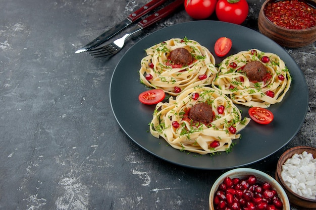 Half-top view cooked dough slices with meatballs on gray background pasta meat dish dinner cooking color restaurant