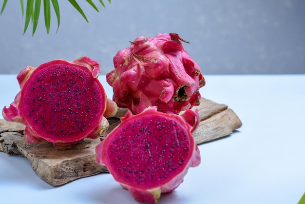 half and whole red dragon fruit ripe and fresh