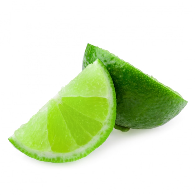 Half with slice of fresh green lime isolated on white background