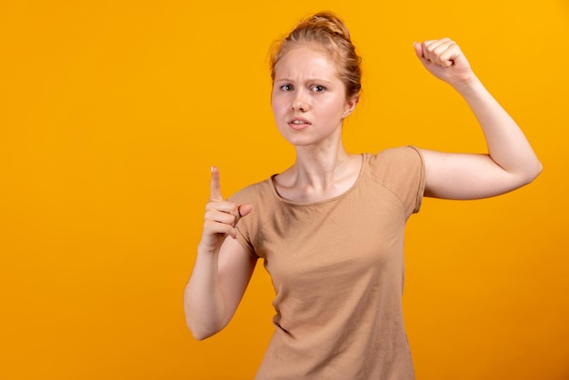 Halflength portrait of young romantic girl isolated on yellow studio background concept of human