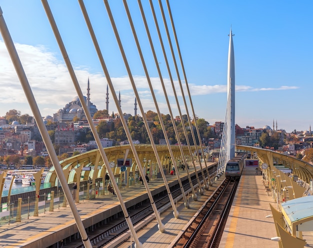 Halic Metro Bridge train platform and the Suleymaniye Mosque in the background, Istanbul.