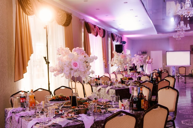 Hall decor for events wedding decor presidium and tables for guests with flowers table decor elements