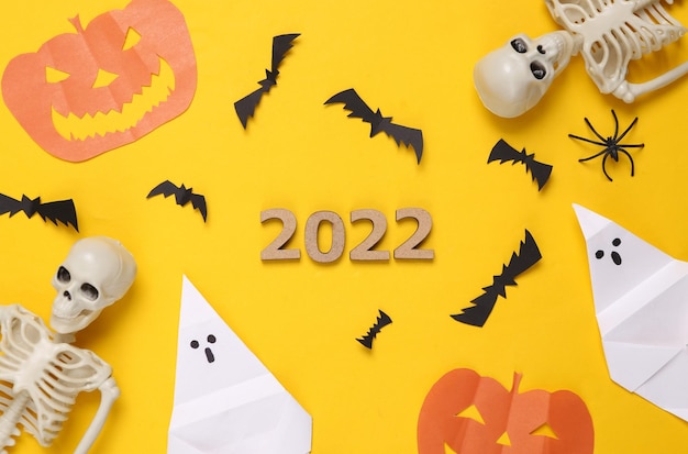 Halloween 2022 Halloween decor on a yellow background Top view