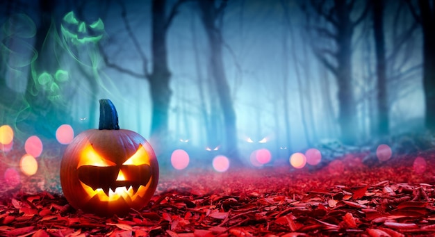 Photo halloween abstract party smiling pumpkins on defocused shiny background