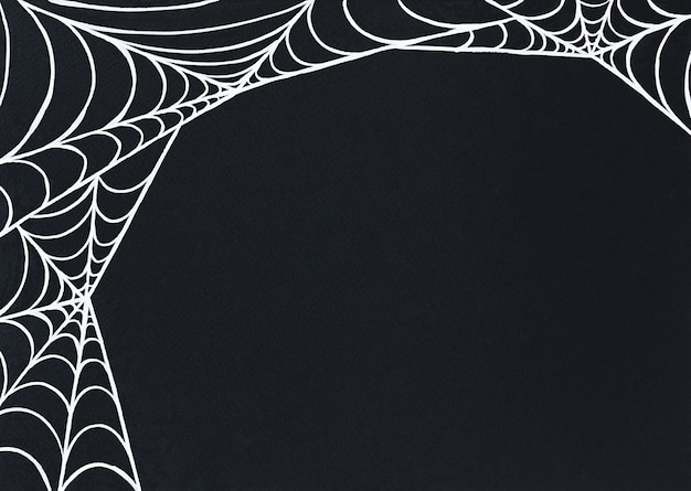 Photo halloween background of white spiders web in the corner of a black surface