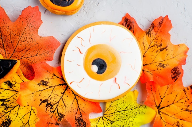 Halloween background with cookies and leaves