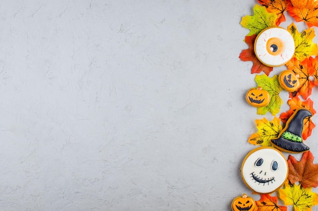 Halloween background with cookies pumpkin leaf