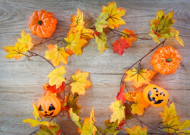 Halloween background with dry leaves autumn on wood